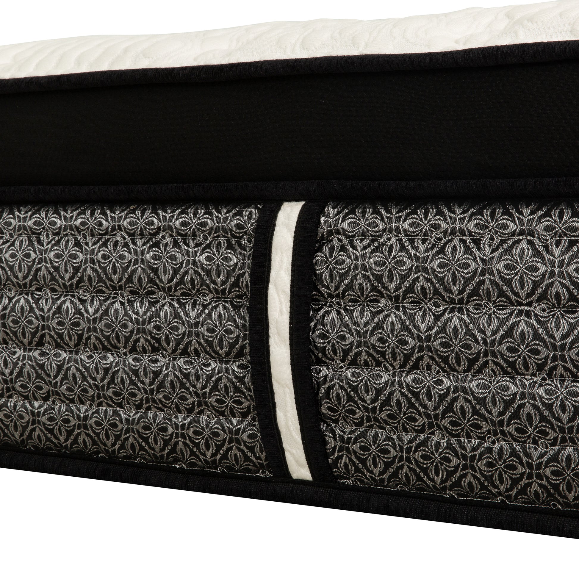 Black and white quilted mattress with intricate damask pattern soft fabric border