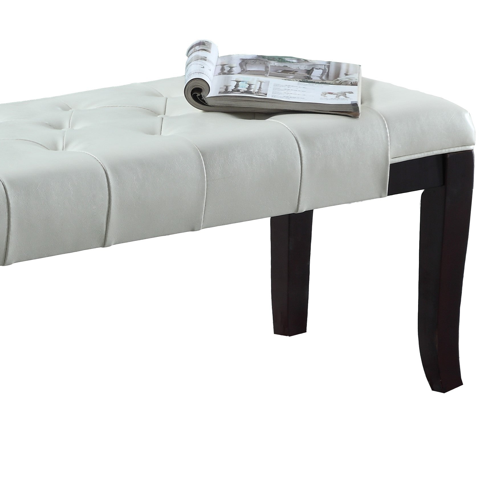 White faux leather tufted bench with dark wood legs