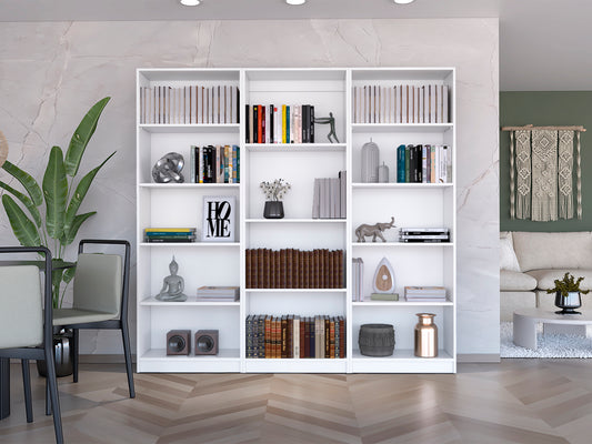 White modular bookshelf with rows of books and decorative items