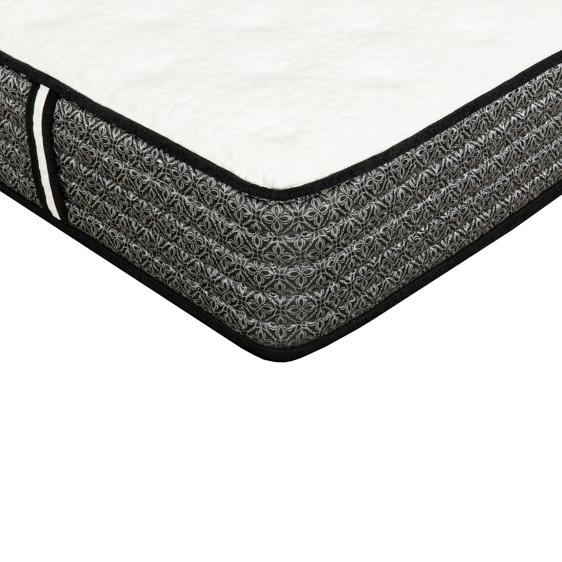 Closeup of a white quilted mattress top with a black and silver patterned side border