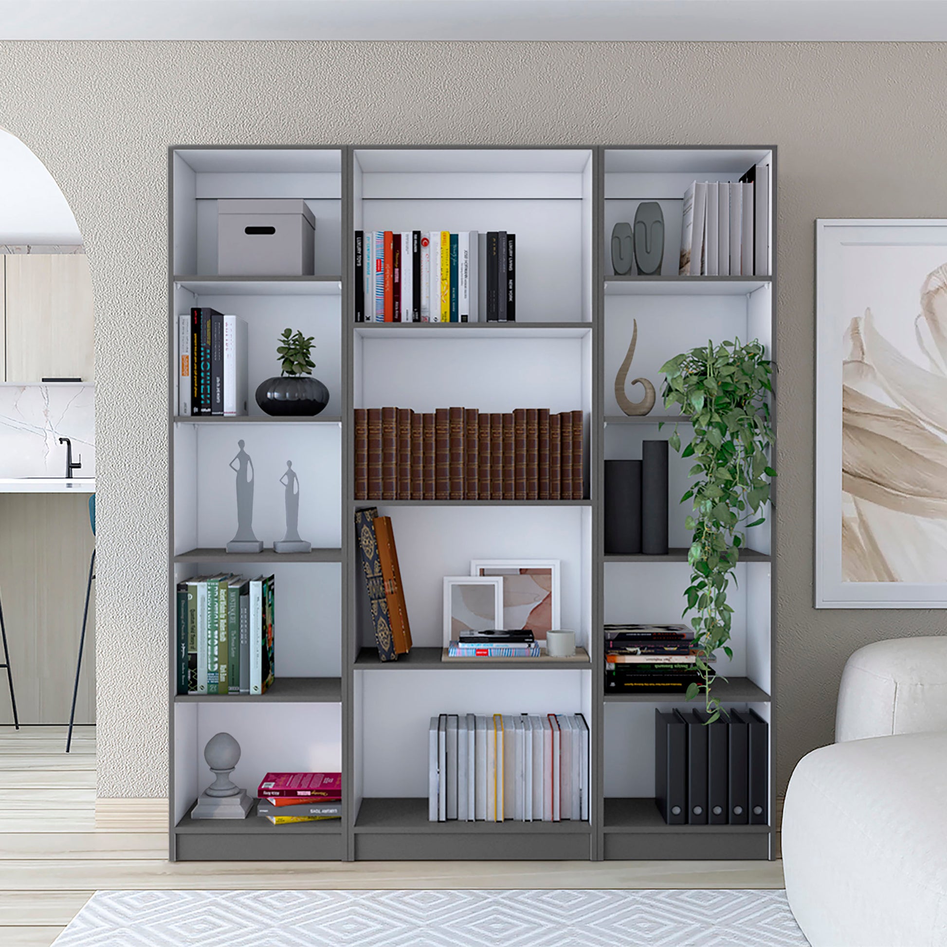 Gray and white modern bookcase filled with books decor and binders