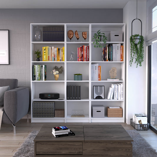 White modern bookshelf filled with colorful books and decorative items