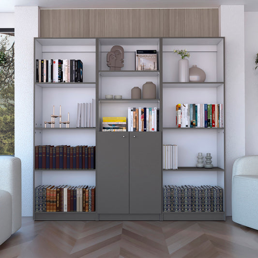Modern grey modular bookshelf with assorted hardcover books and decorative vases