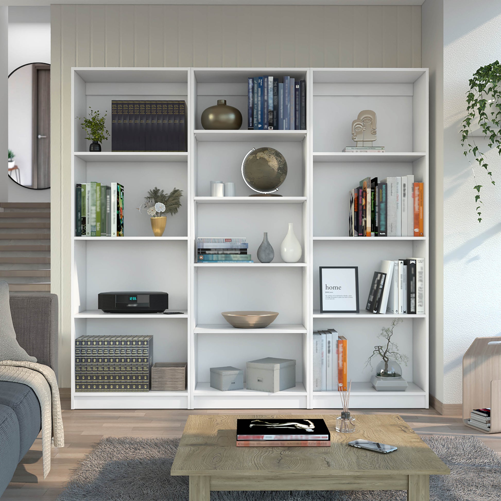 White modern bookshelf filled with books decor and a globe