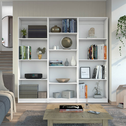 White modern bookshelf filled with books decor and a globe