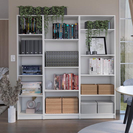 White bookcase filled with books and decorative items including lush green hanging plants