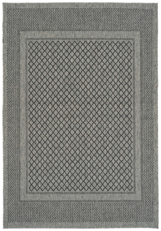 Gray area rug with a central diamond pattern and geometric border