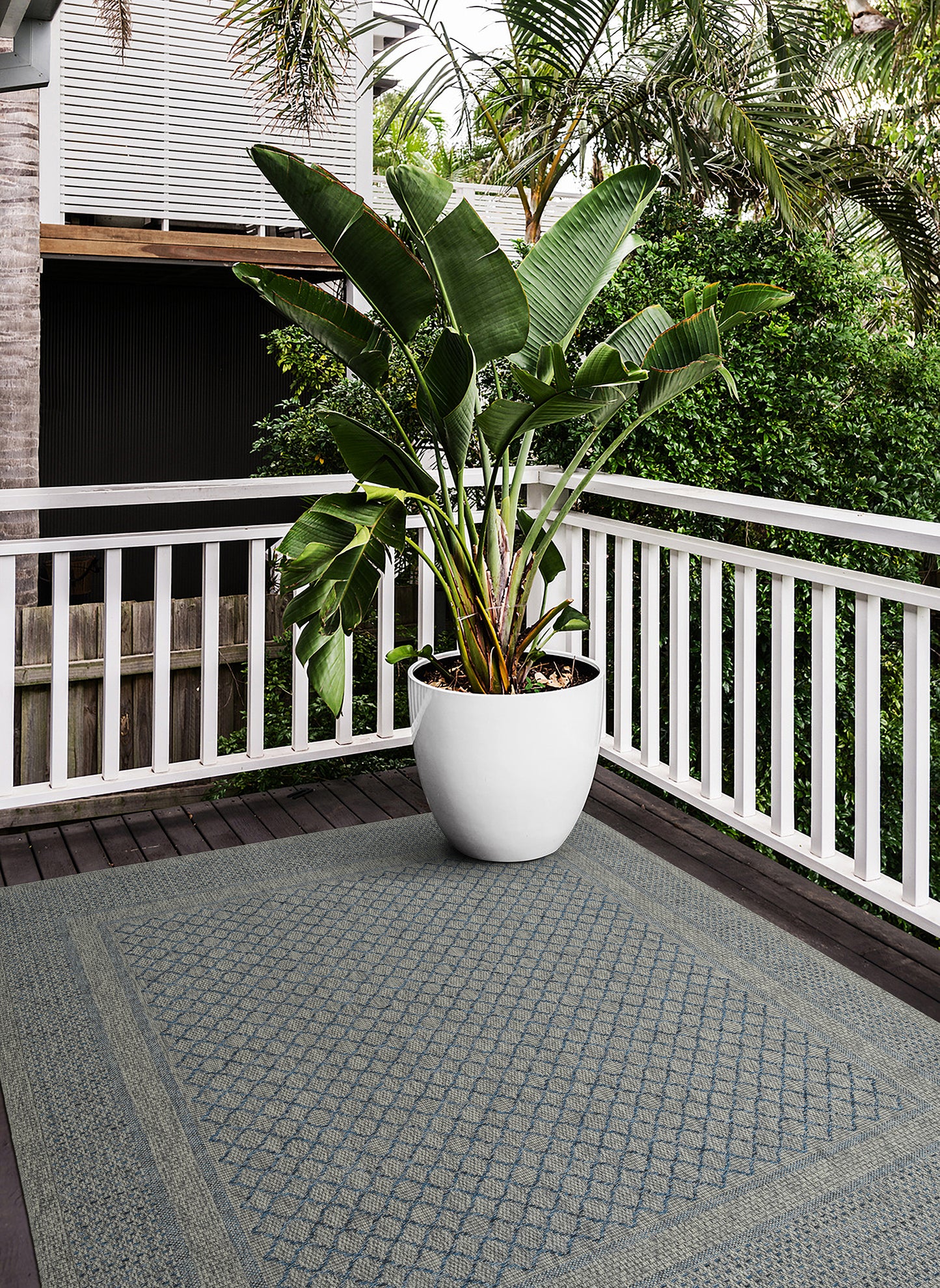 Outdoor rug with grey and blue diamond pattern perfect for patios
