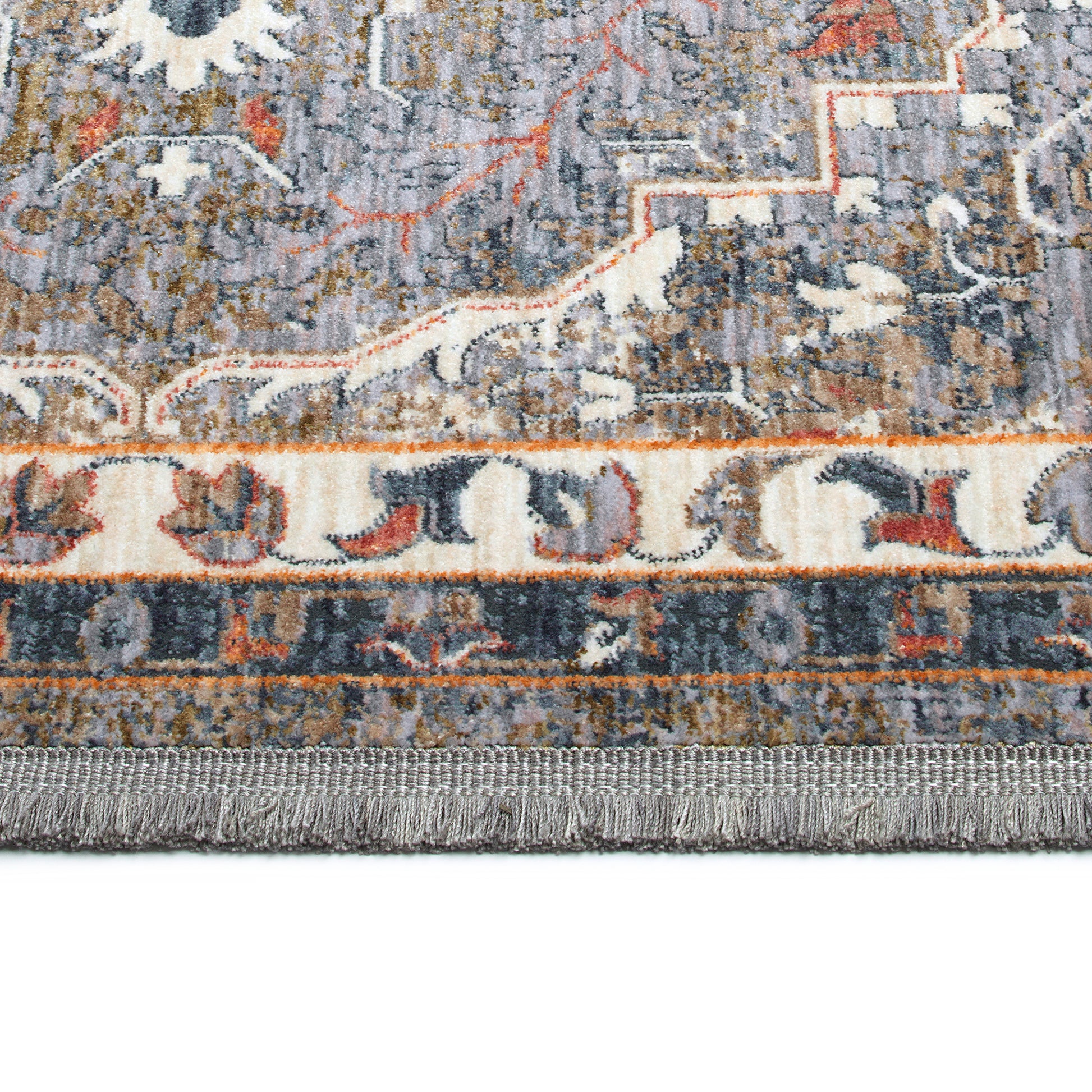 Gray distressed oriental rug with cream and orange accents and fringe detail