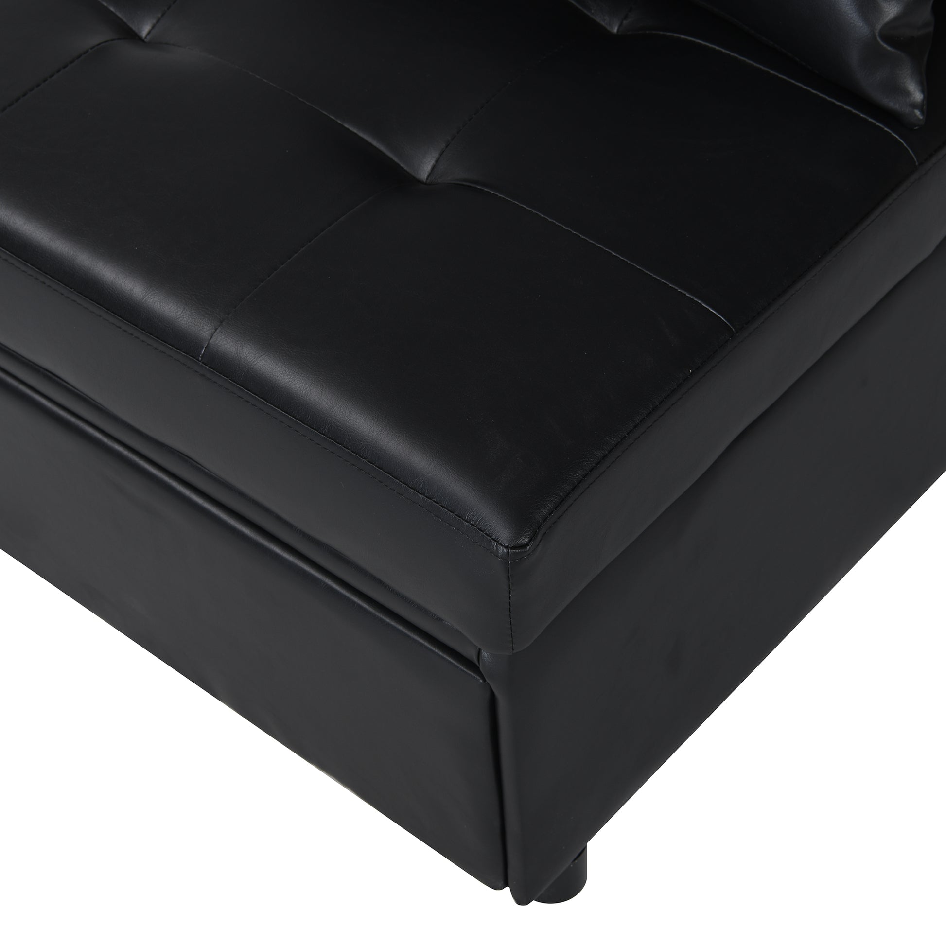 Black faux leather tufted storage ottoman corner detail with clean stitching