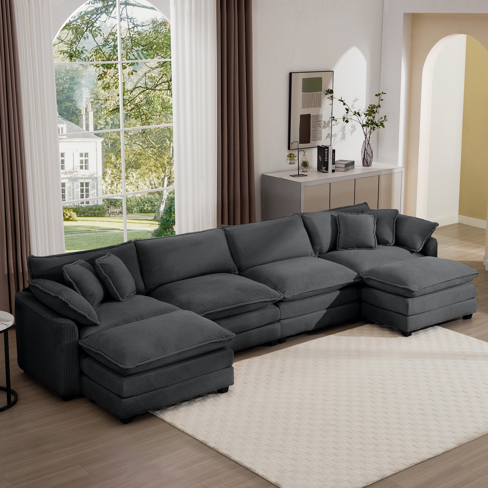 Dark gray corduroy sectional sofa with plush cushions and matching pillows perfect for modern living rooms