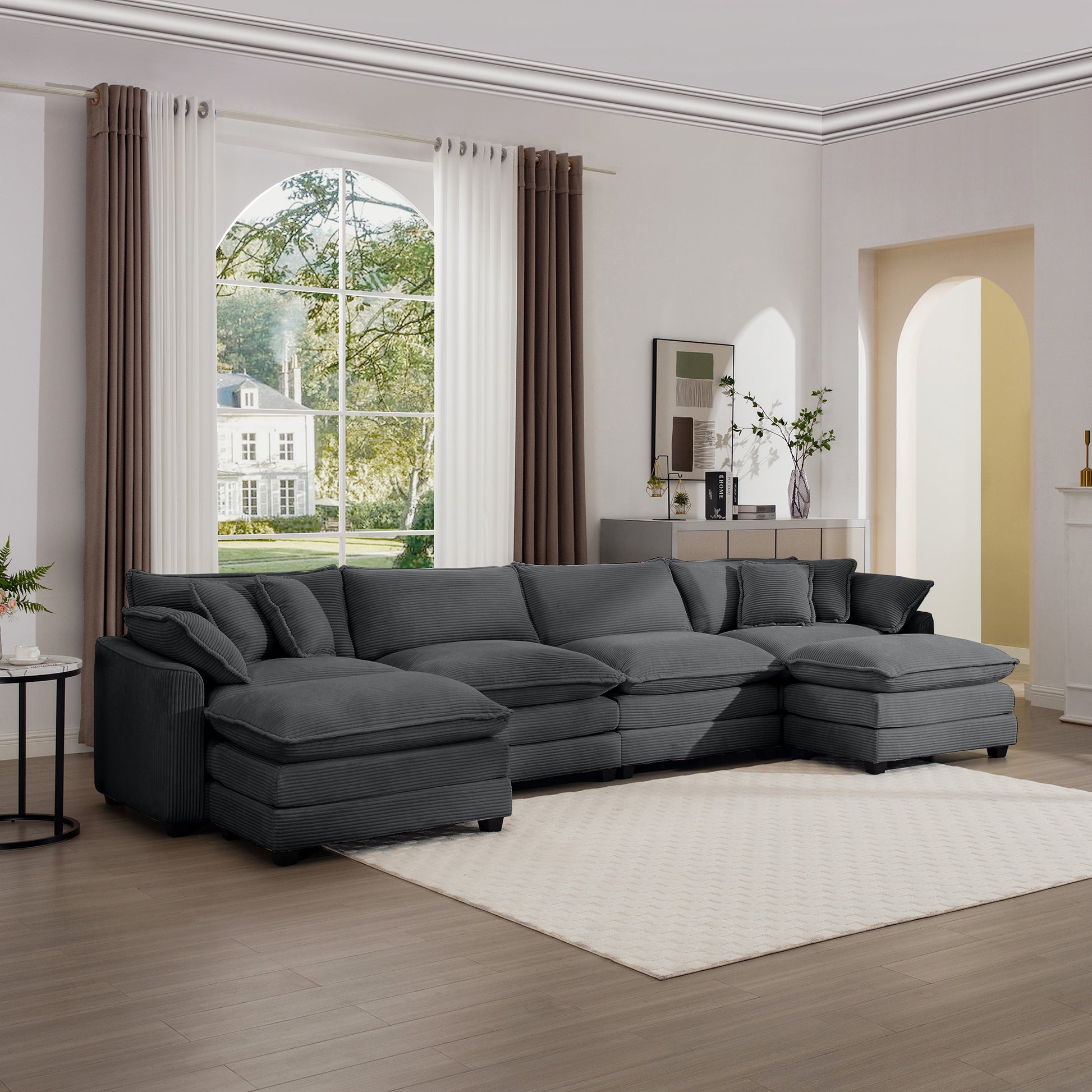 Deep charcoal corduroy sectional sofa with plush cushions offering ample seating for a modern living room