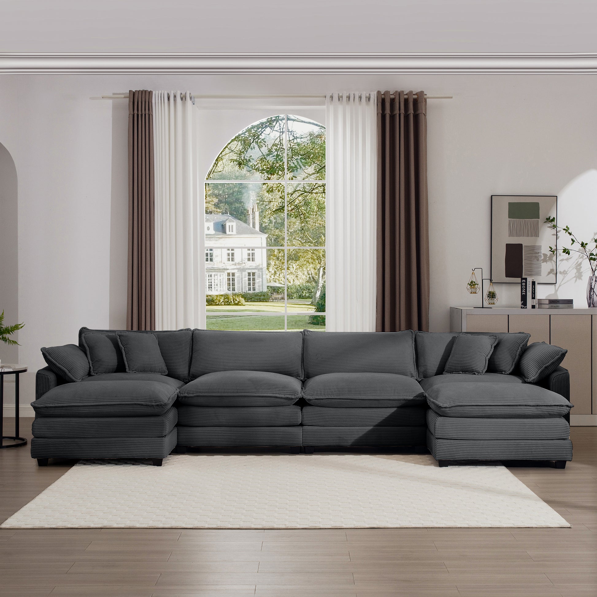 Plush dark gray corduroy sectional sofa with multiple cushions perfect for a spacious living room