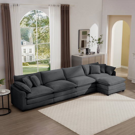 Plush charcoal sectional sofa with textured fabric and multiple throw pillows