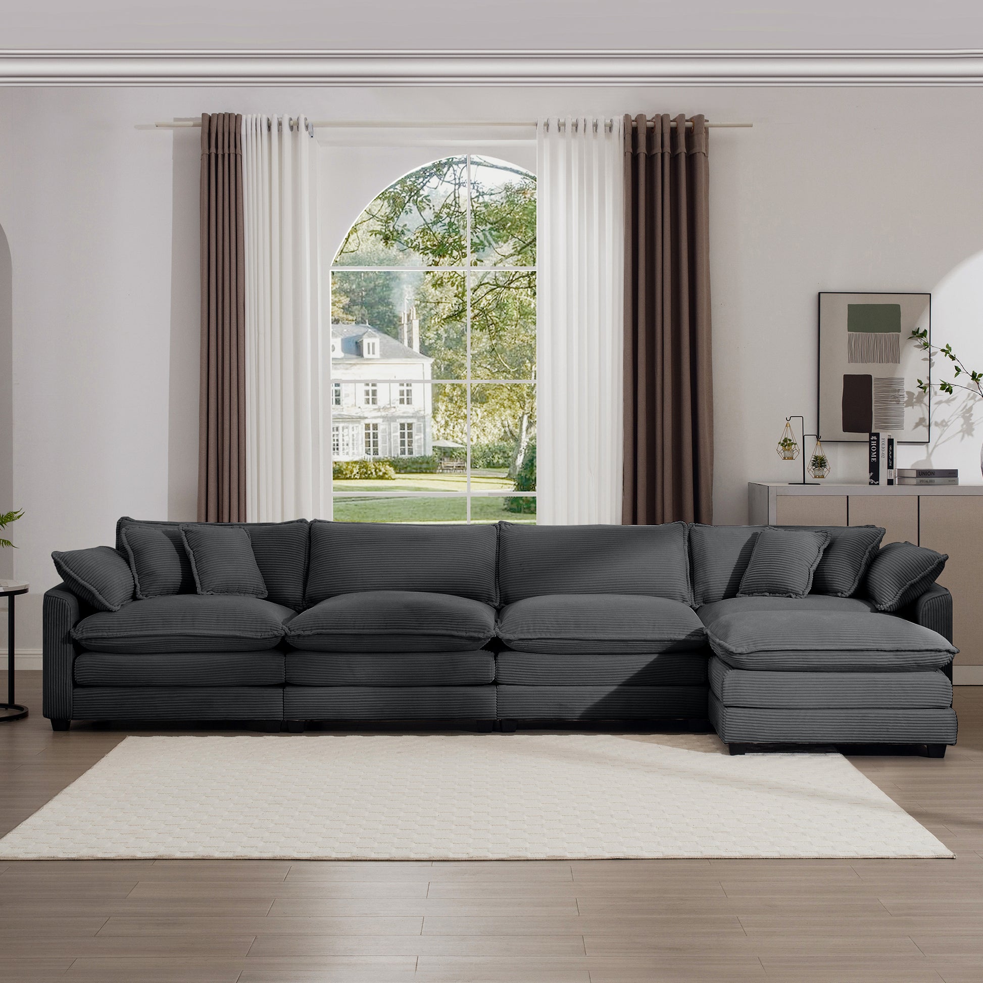 Plush charcoal gray corduroy sectional sofa with deep cushions and matching throw pillows
