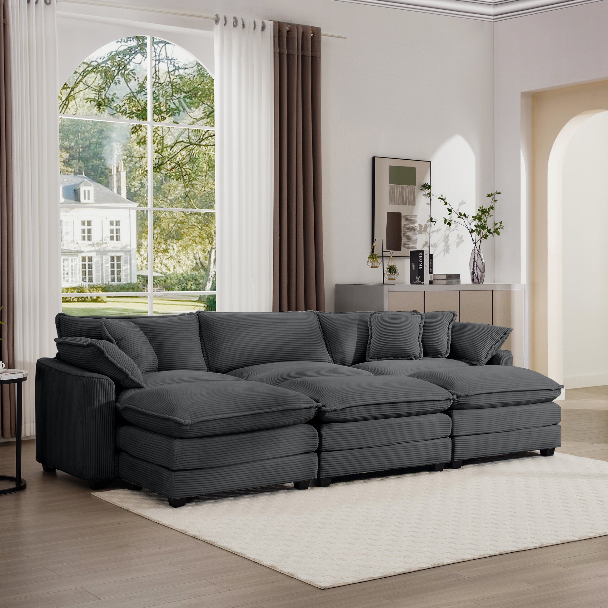 Deep charcoal corduroy sectional sofa with plush cushions and modular seating