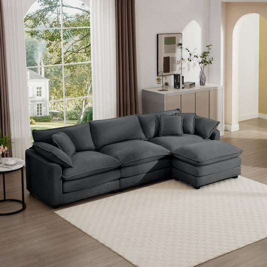 Dark gray corduroy sectional sofa with plush cushions and chaise lounge
