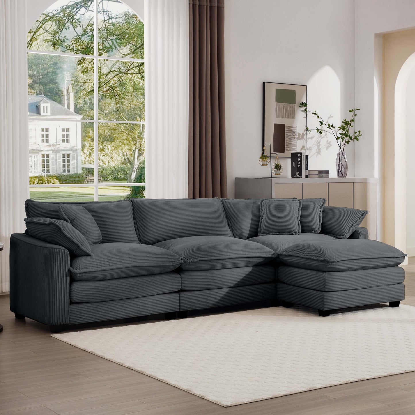 Plush charcoal corduroy sectional sofa with deep seats and multiple throw pillows for ultimate comfort