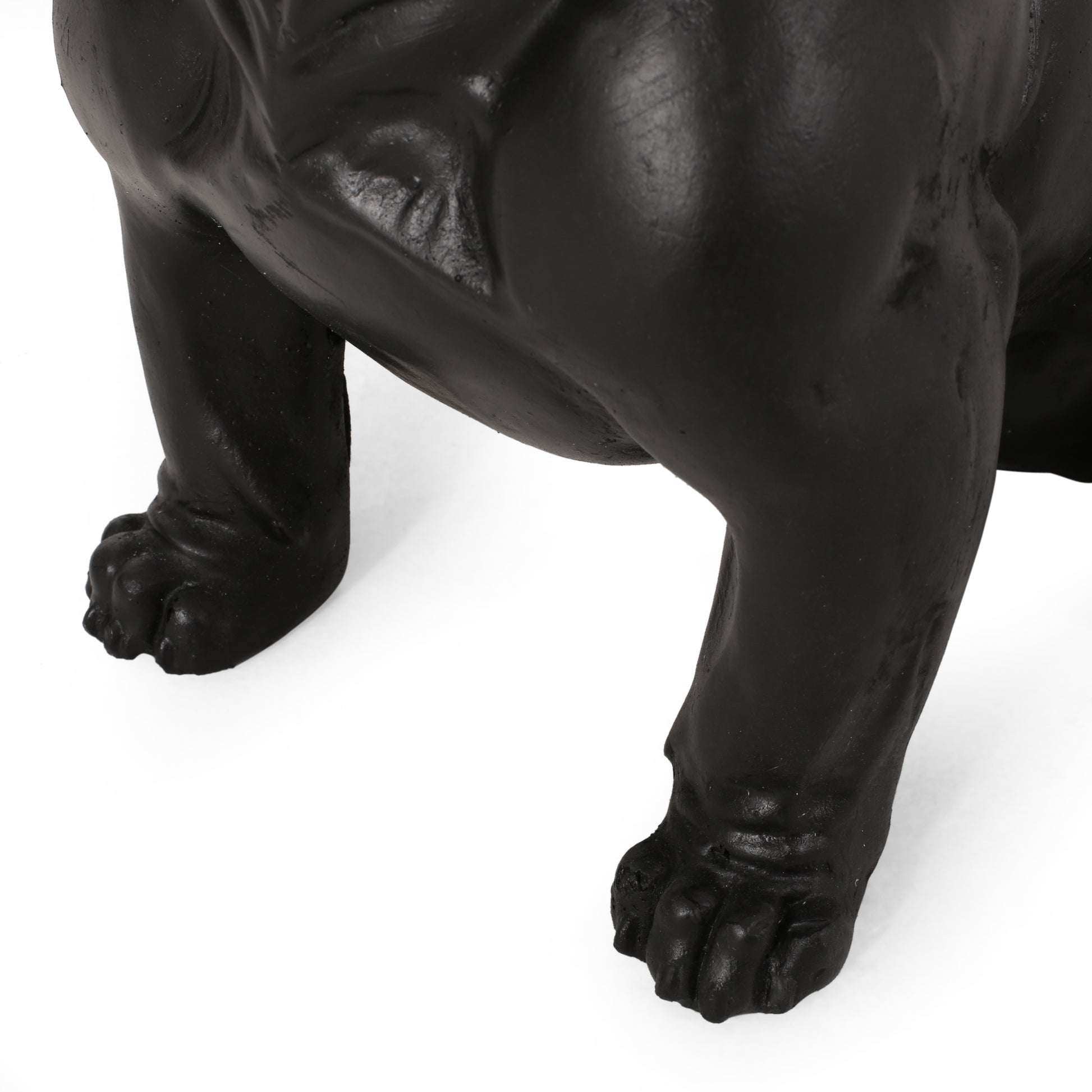 Black French Bulldog statue with textured paws a classic decorative accent