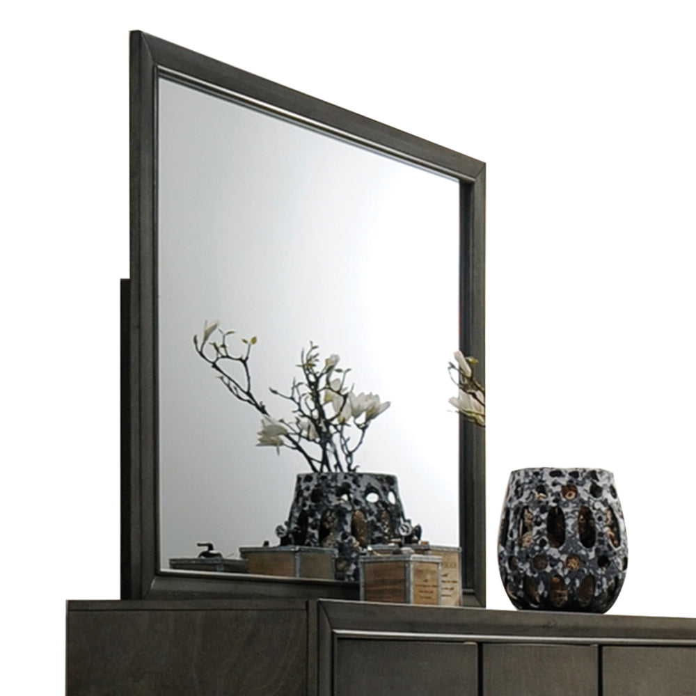 Dark wood dresser mirror with ornate floral vase
