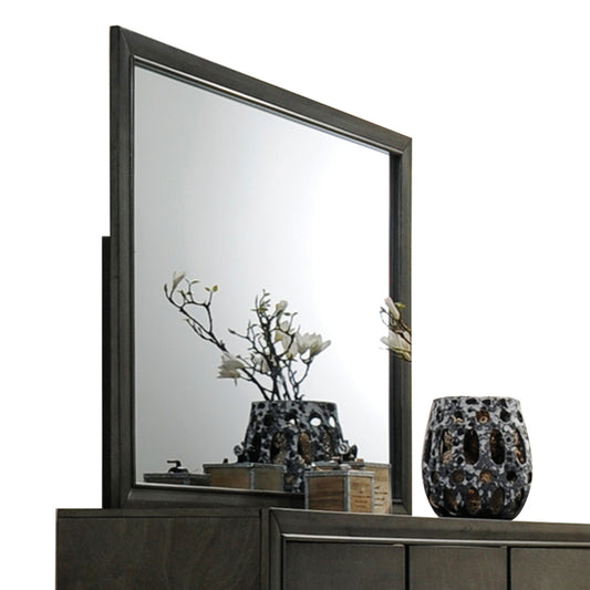 Dark wood dresser mirror with ornate floral vase