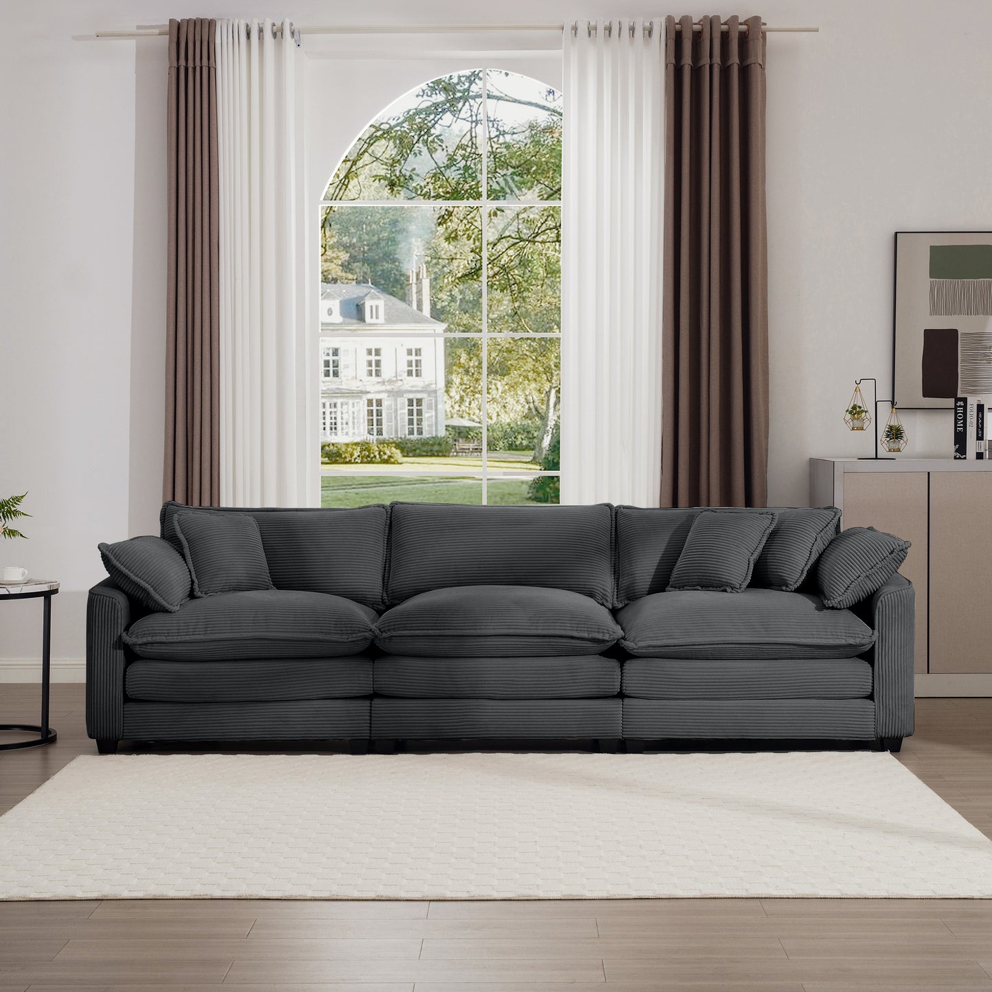 Plush charcoal gray corduroy sofa with plush cushions and matching throw pillows