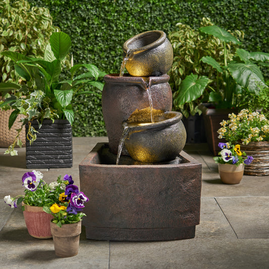 Tiered ceramic garden fountain with cascading water and warm LED lights