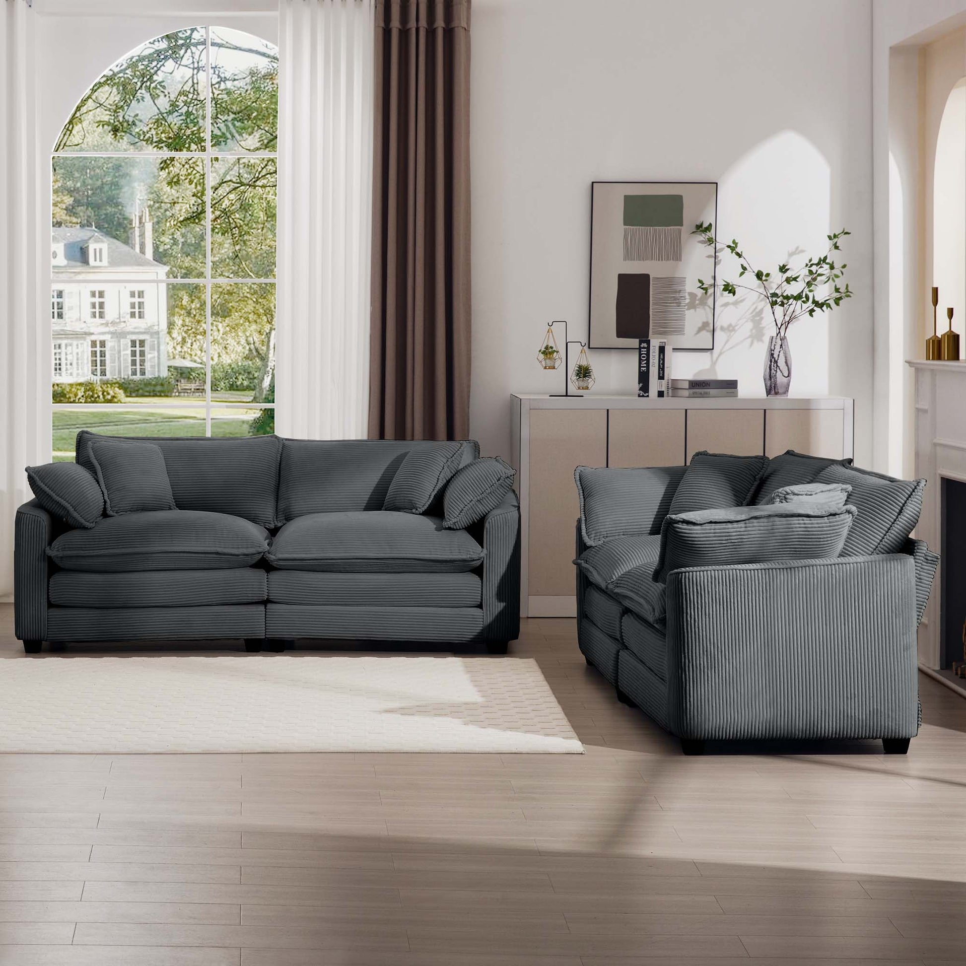 Plush grey corduroy sofa with deep seating and ample cushions for a cozy living room