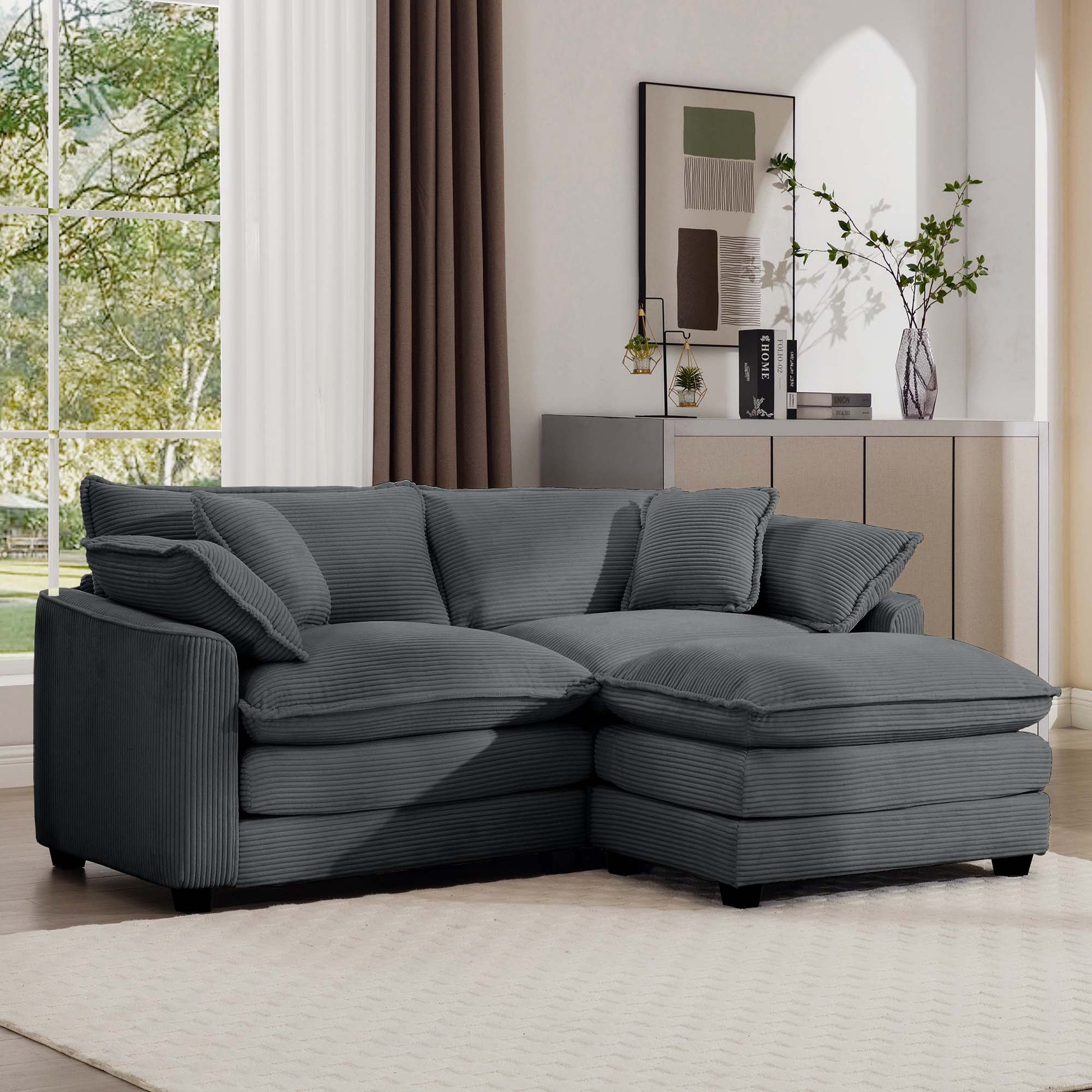 Plush charcoal corduroy sectional sofa with deep seating and multiple throw pillows for ultimate comfort
