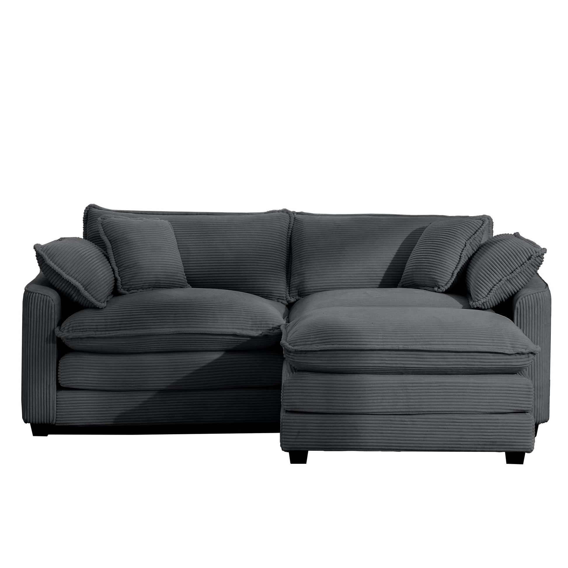 Dark grey corduroy sectional sofa with plush cushions and chaise lounge