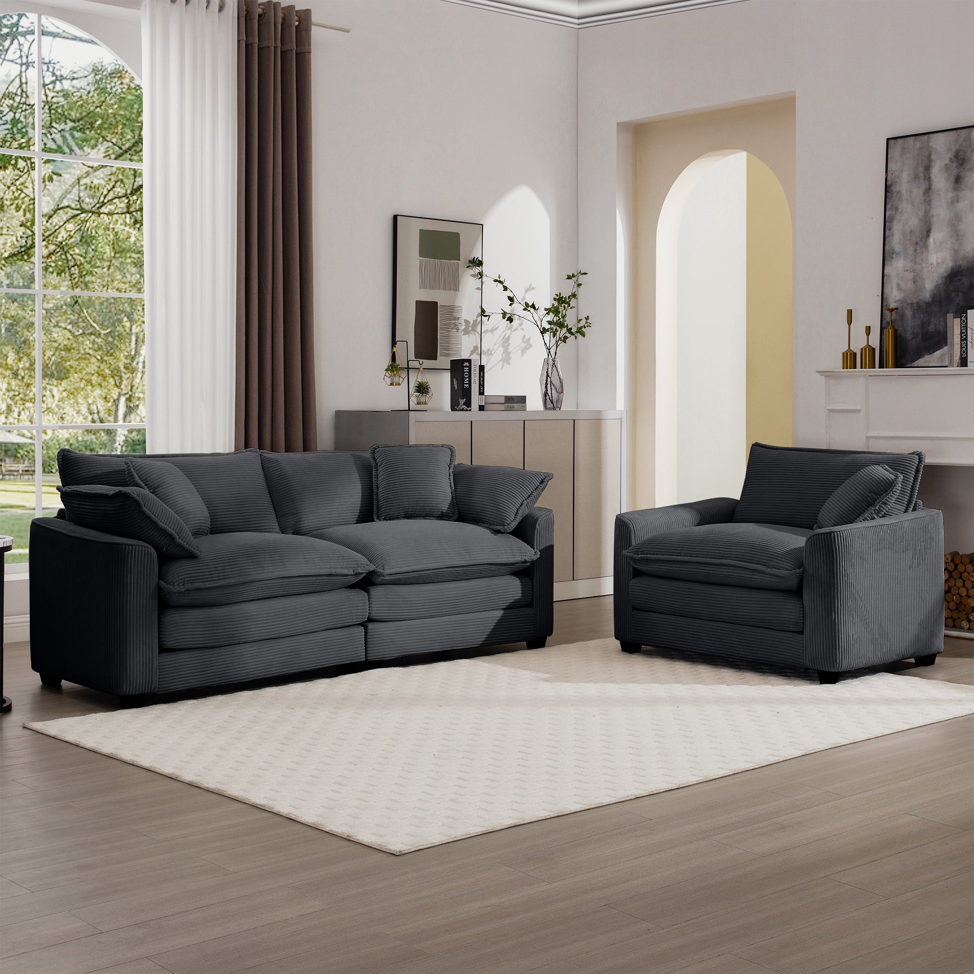 Dark charcoal corduroy sofa with plush cushions and accent pillows