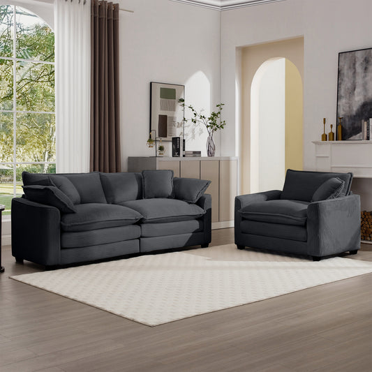 Dark charcoal corduroy sofa with plush cushions and accent pillows