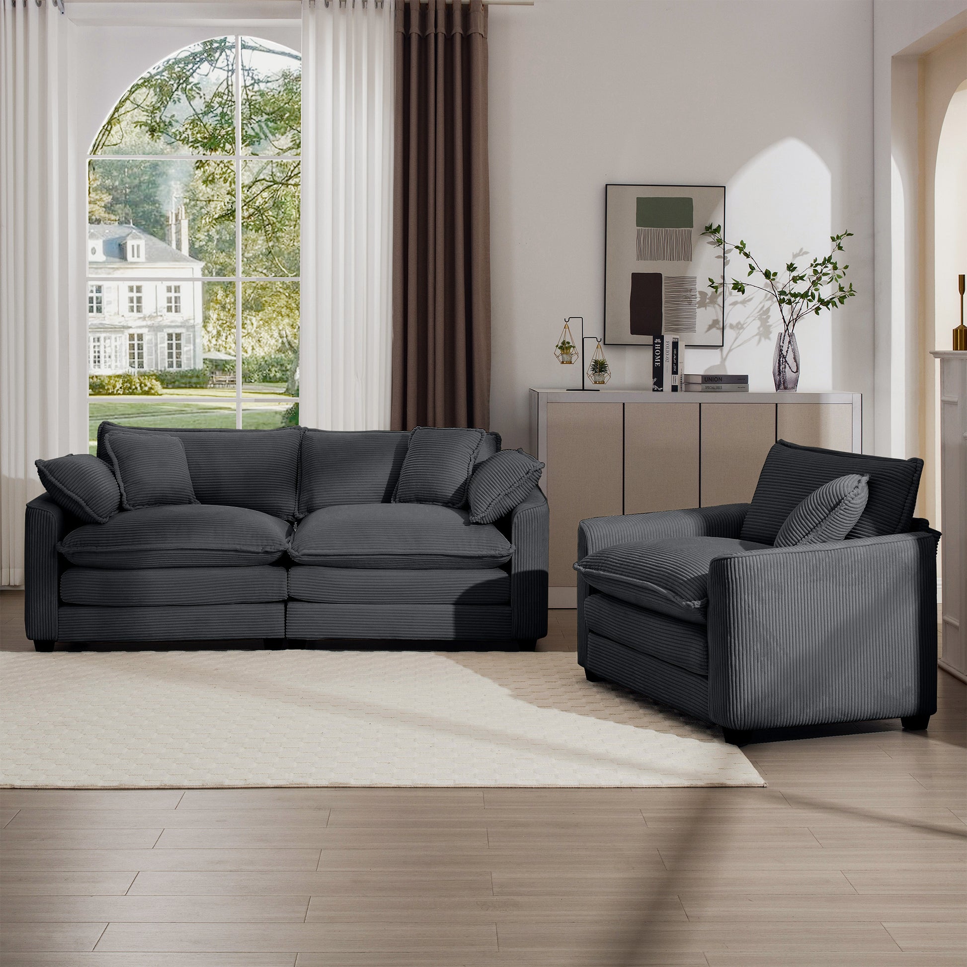 Plush charcoal corduroy sofa with deep seats and accent pillows for ultimate comfort