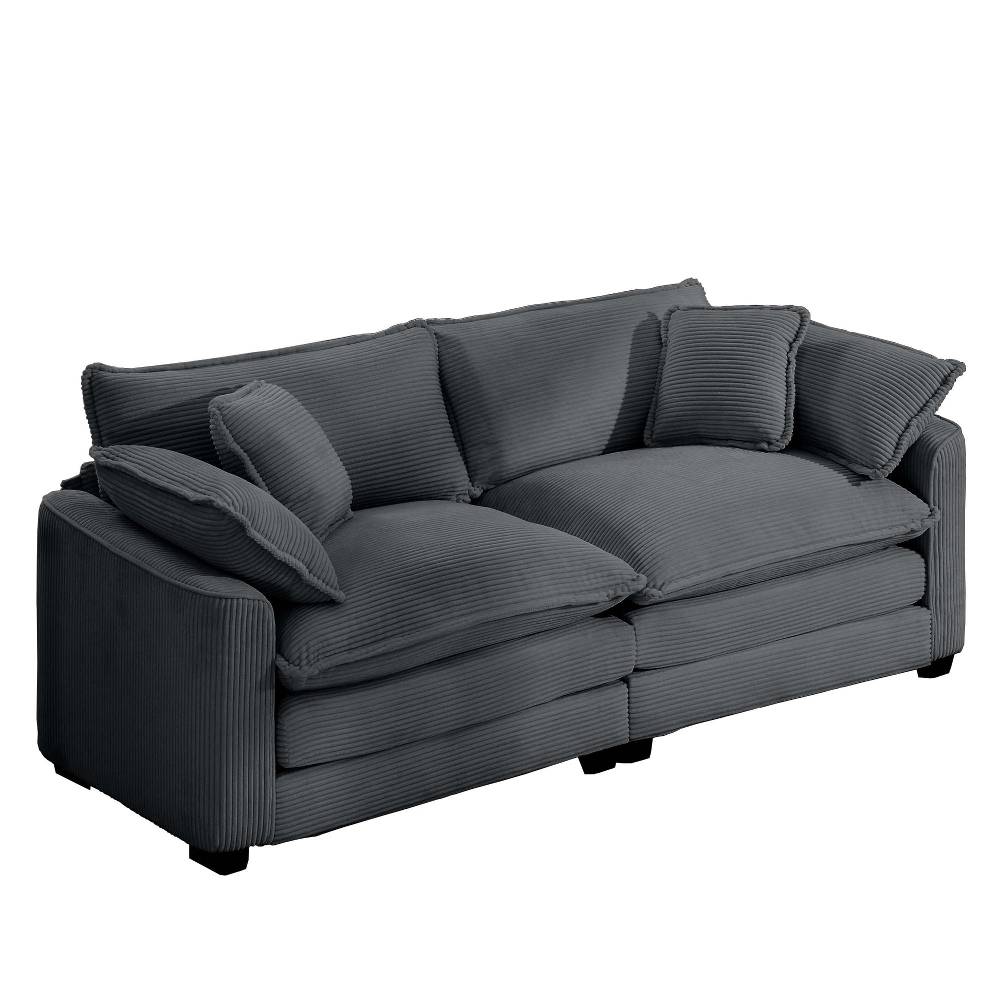 Dark gray corduroy sofa with plush cushions and accent pillows perfect for modern living rooms