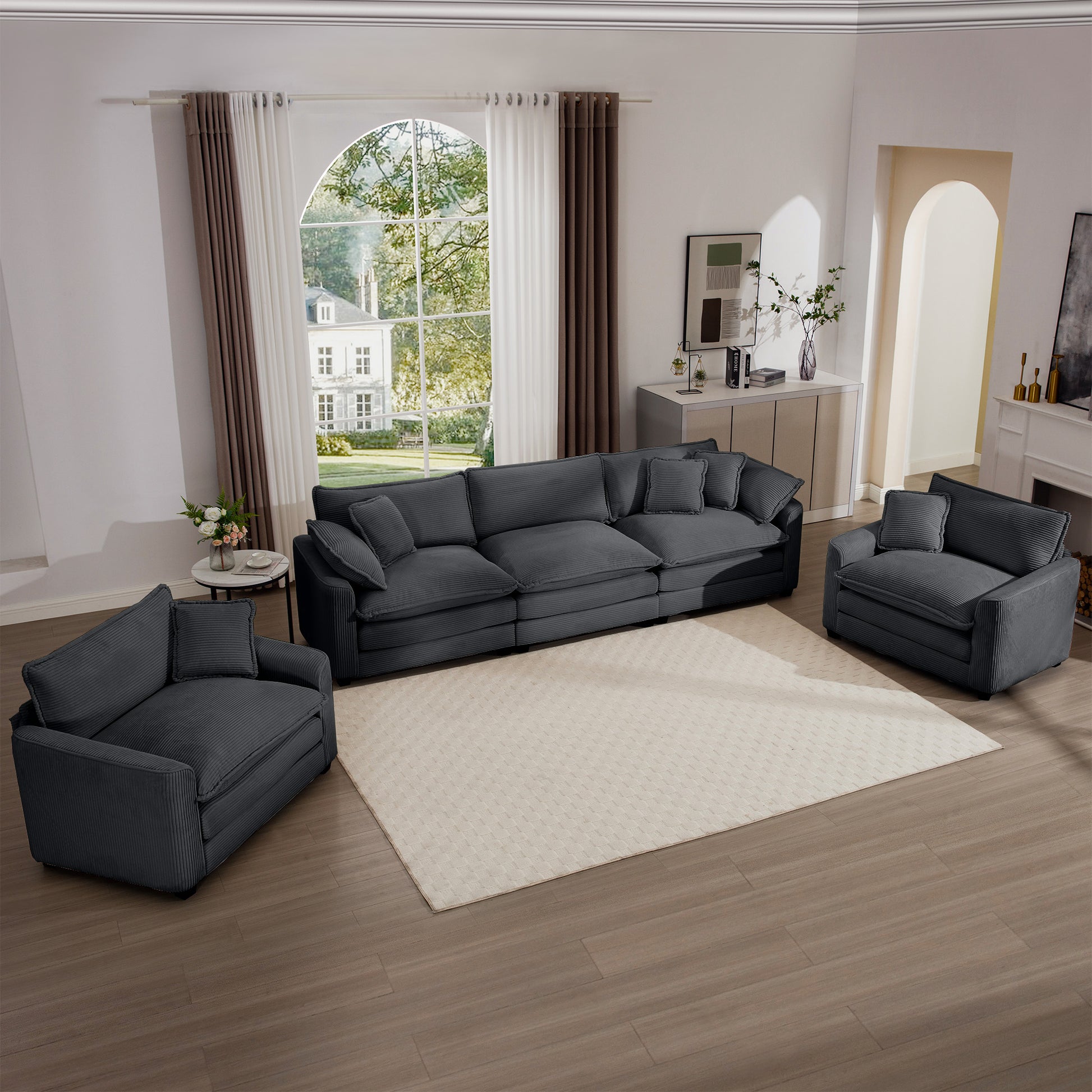 Threepiece dark grey corduroy sectional sofa with plush cushions and accent pillows