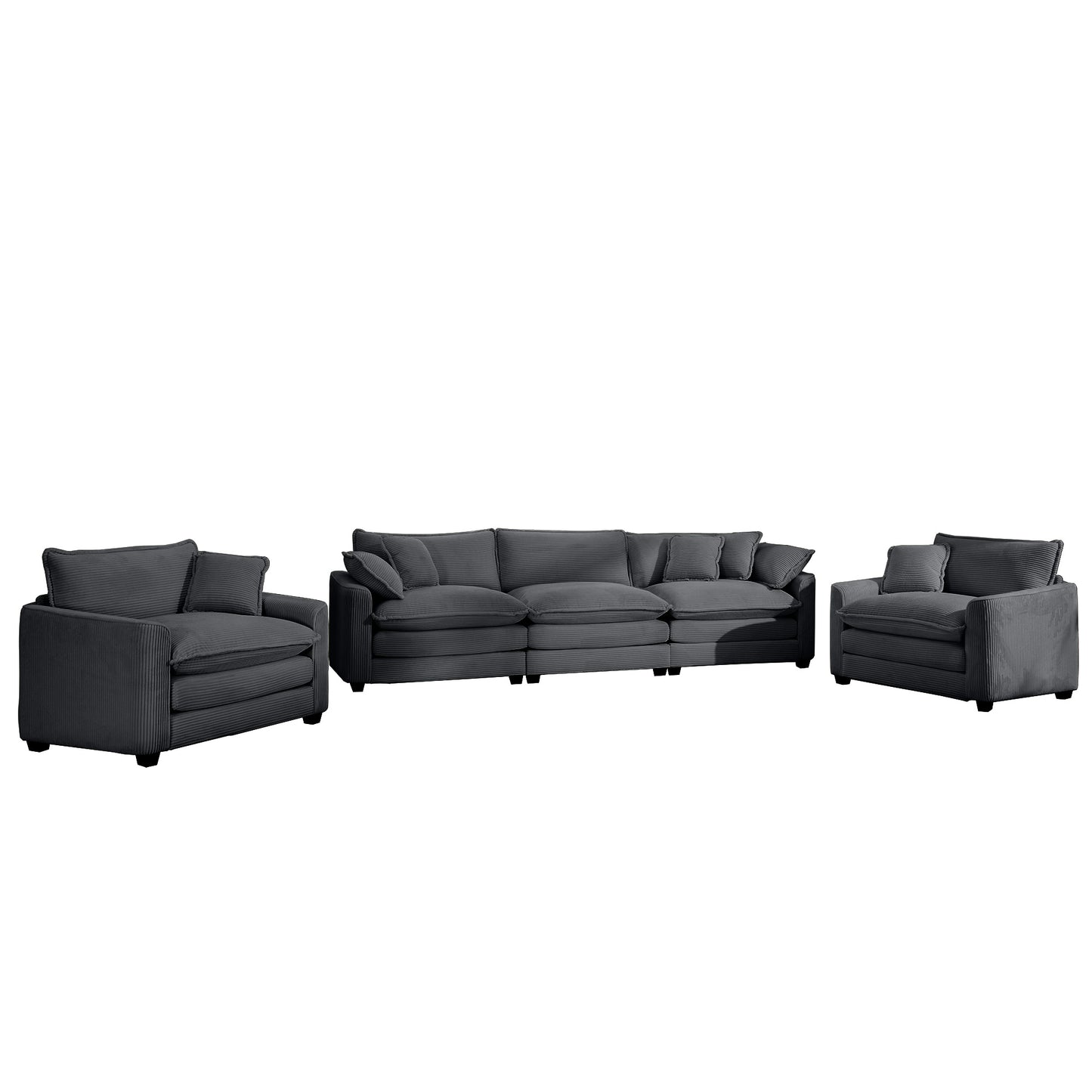 Plush dark grey corduroy sectional sofa with matching armchairs for a cozy living room