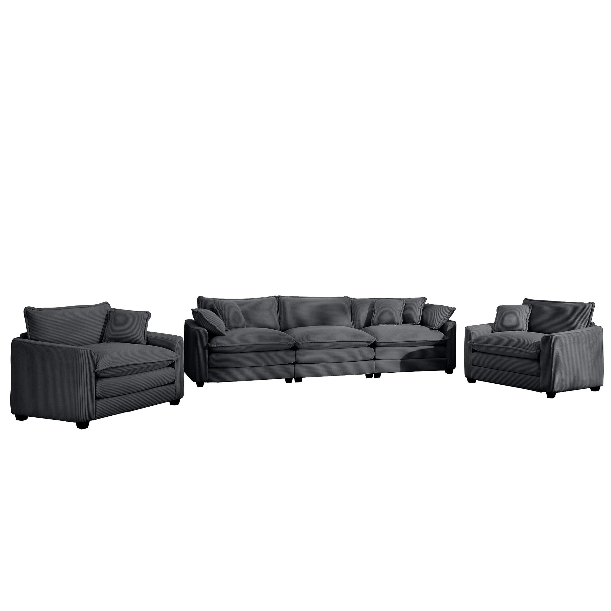 Plush dark grey corduroy sectional sofa with matching armchairs for a cozy living room