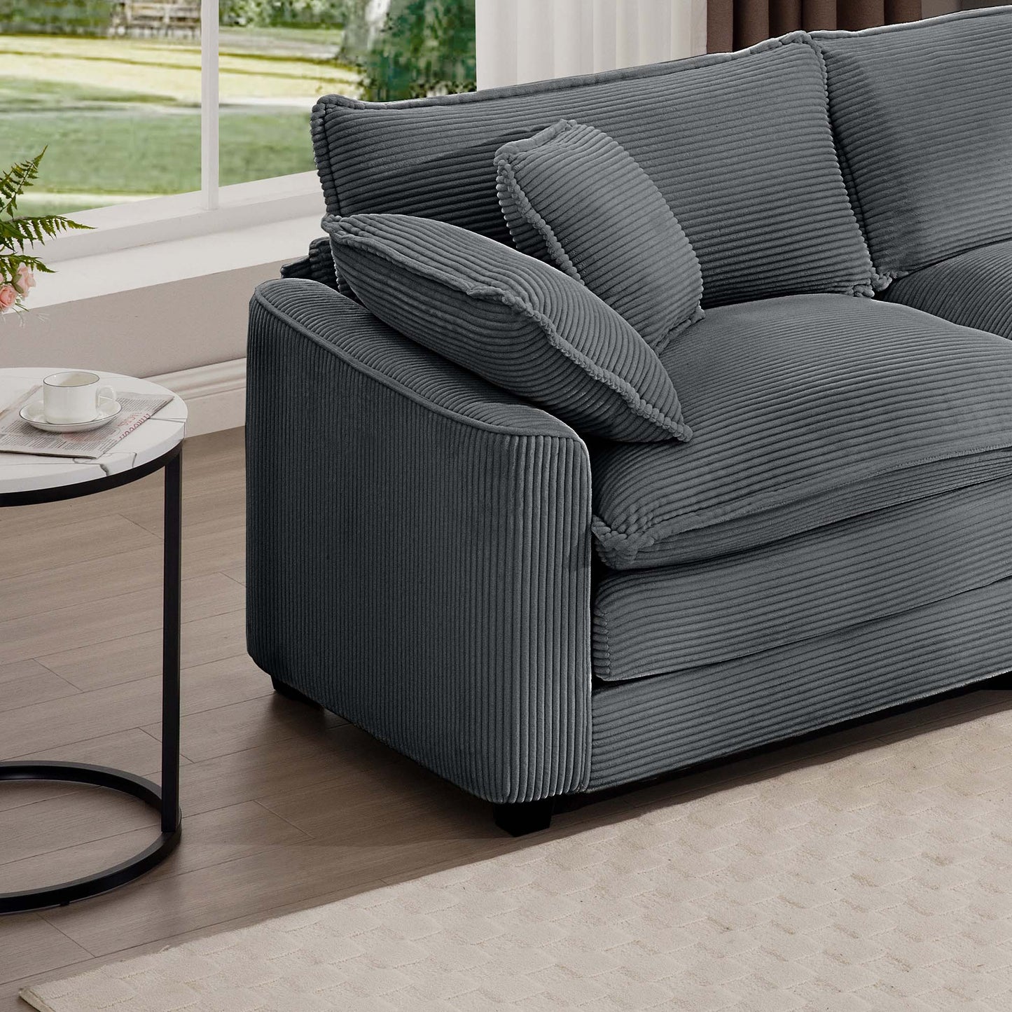 Gray corduroy sofa with plush cushions perfect for a cozy living room setting