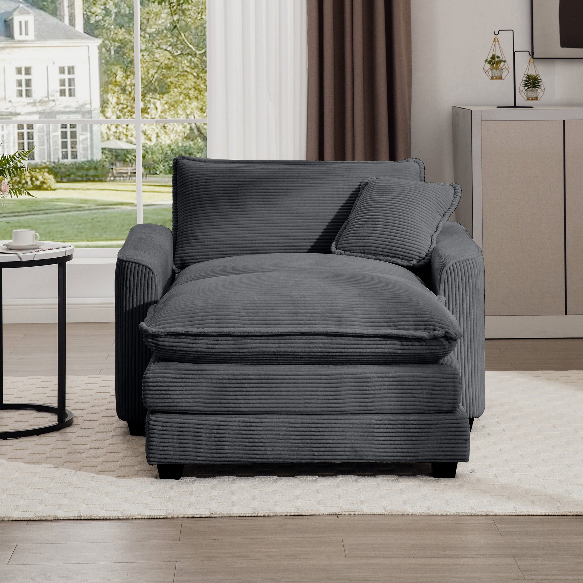 Cozy charcoal grey corduroy chaise lounge with plush cushions and matching throw pillow
