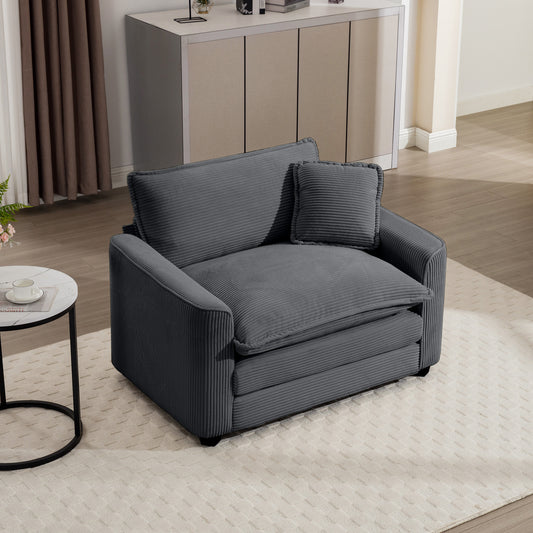 Plush gray corduroy accent chair with deep seating and a lumbar pillow perfect for a cozy living room