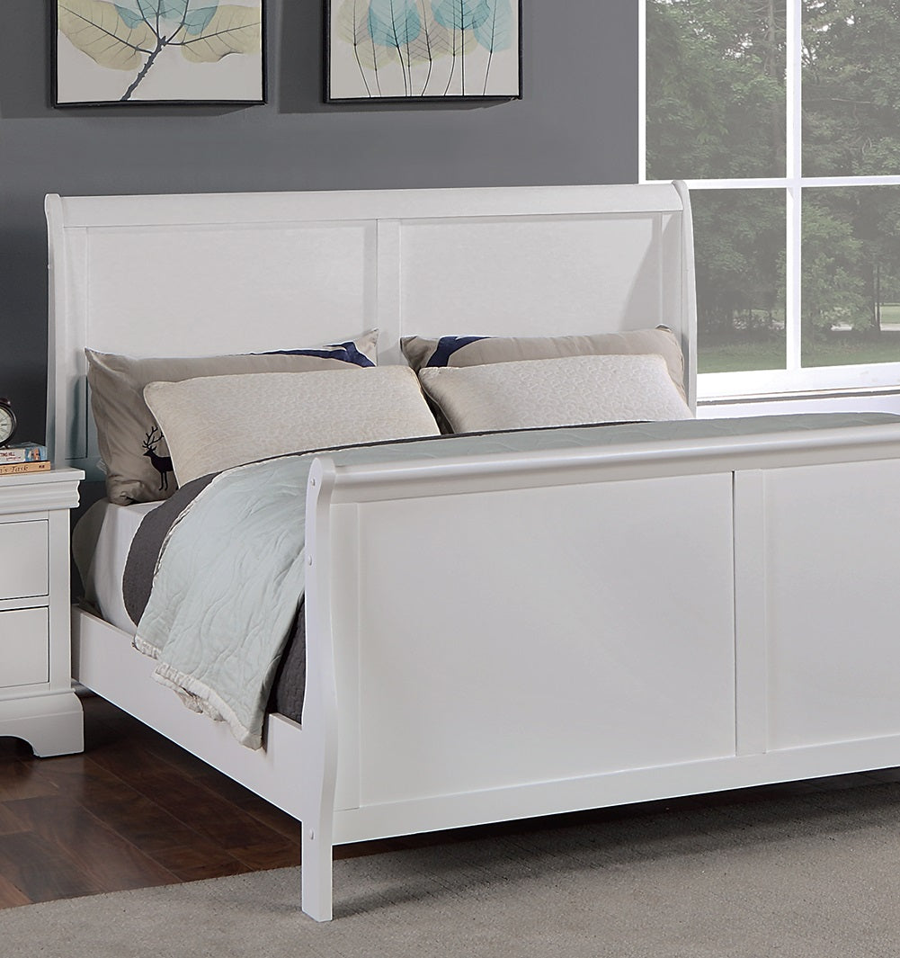 White sleigh bed with upholstered pillows and a grey quilt