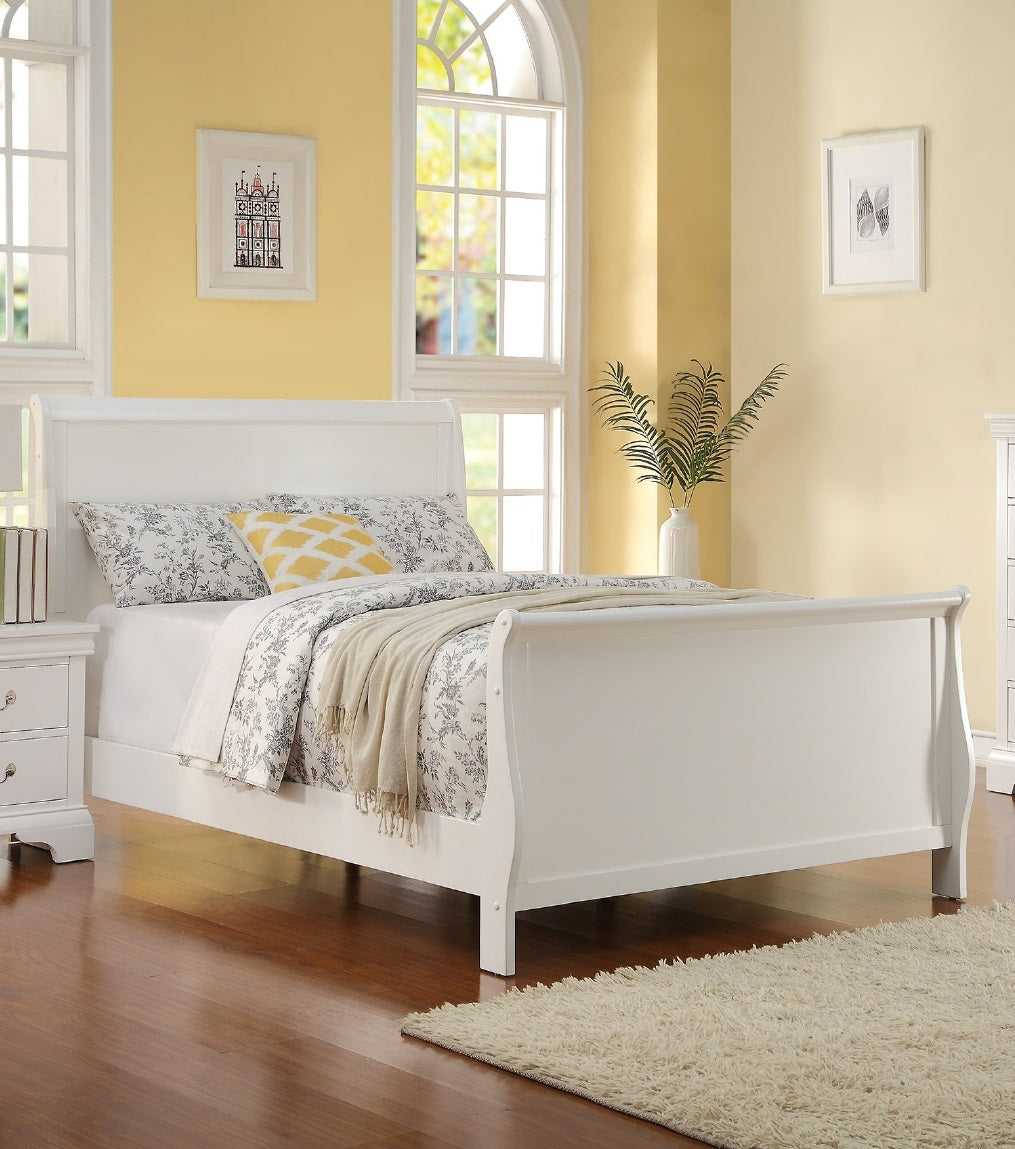 Elegant white sleigh bed with floral duvet and yellow accent pillow