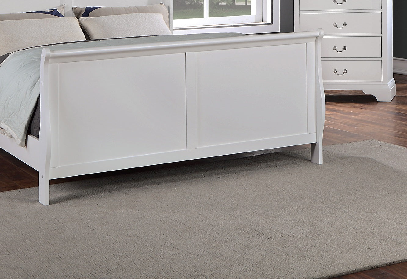 White sleigh bed frame with paneled headboard detail