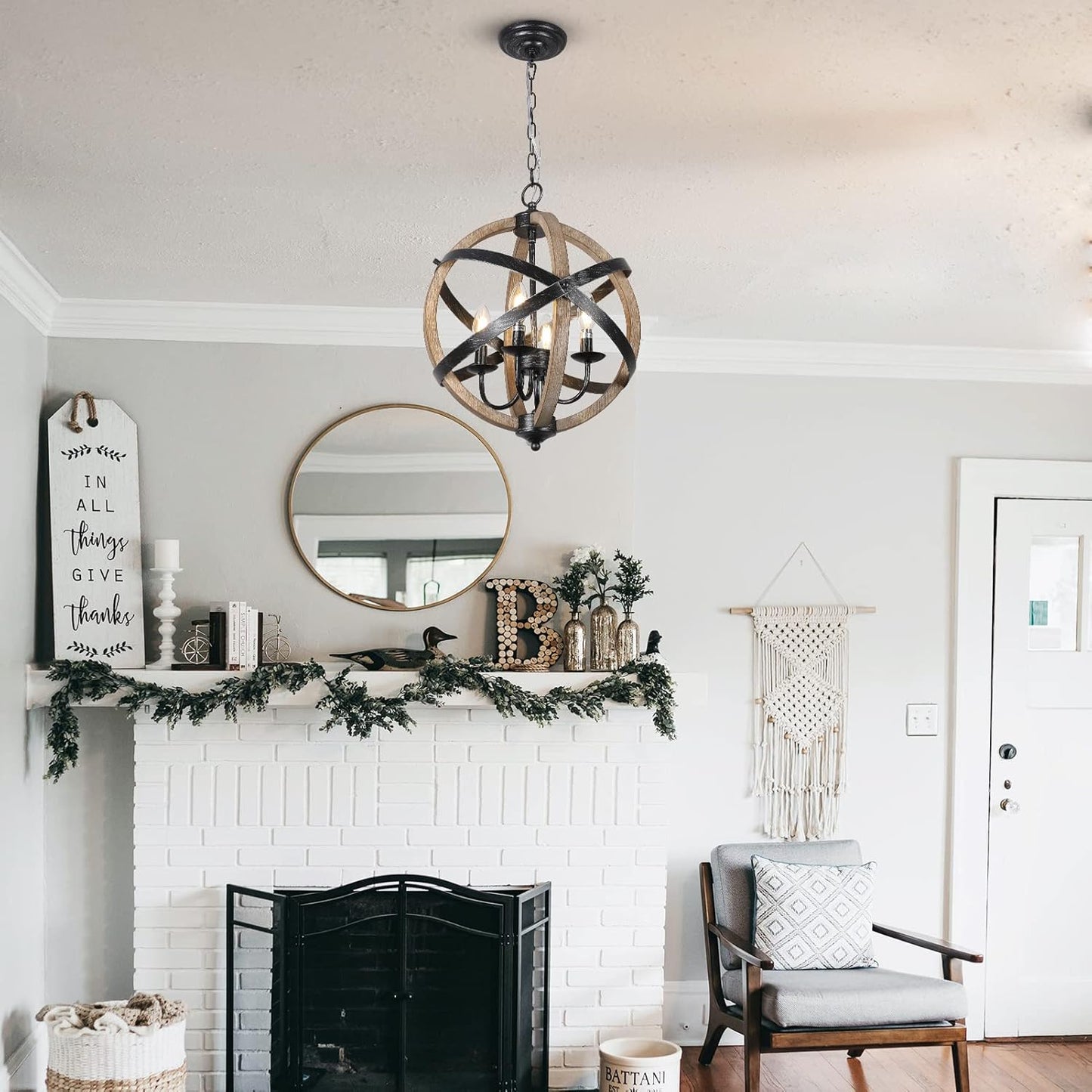 Rustic orb chandelier with black metal and faux wood finish illuminating a living room