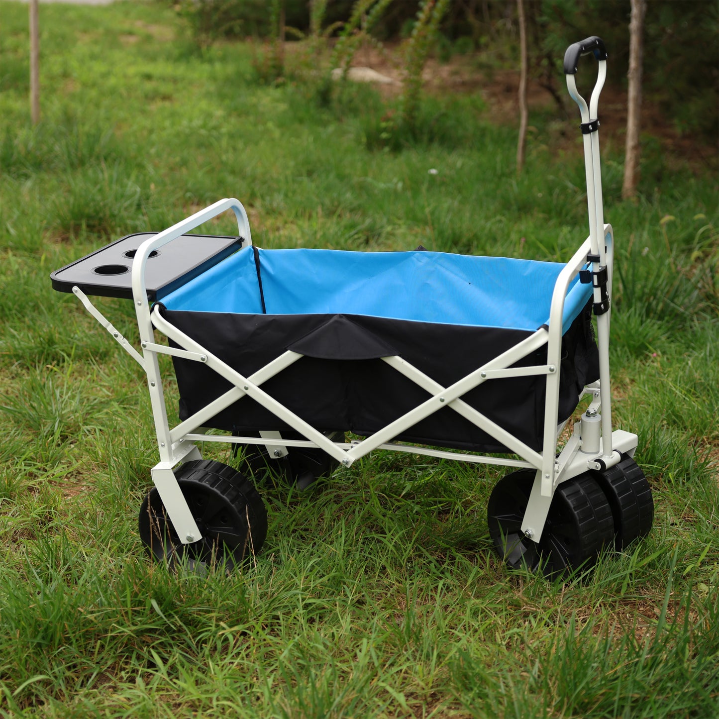 White foldable garden wagon with blue fabric liner and black tray ready for outdoor use