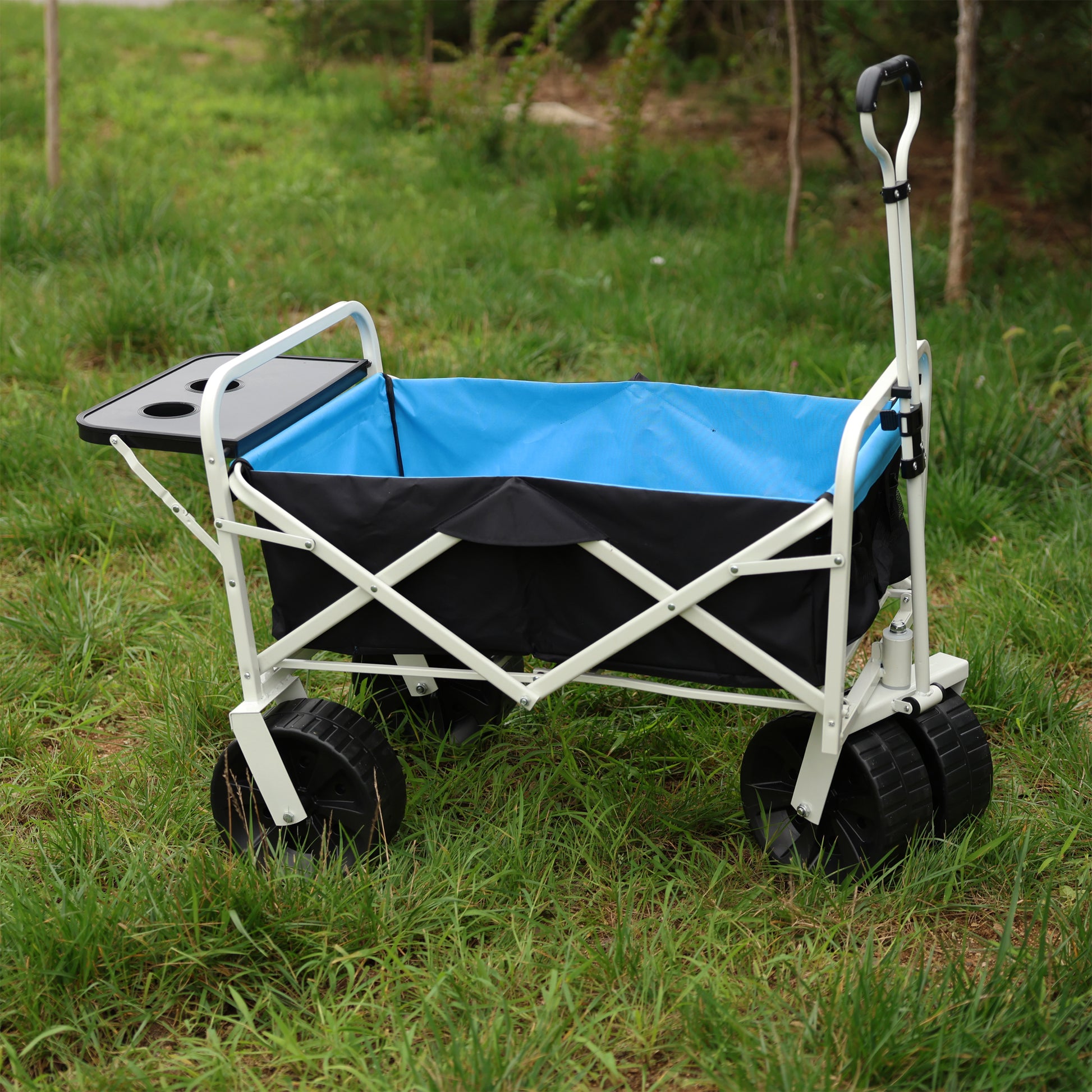 White foldable garden wagon with blue fabric liner and black tray ready for outdoor use