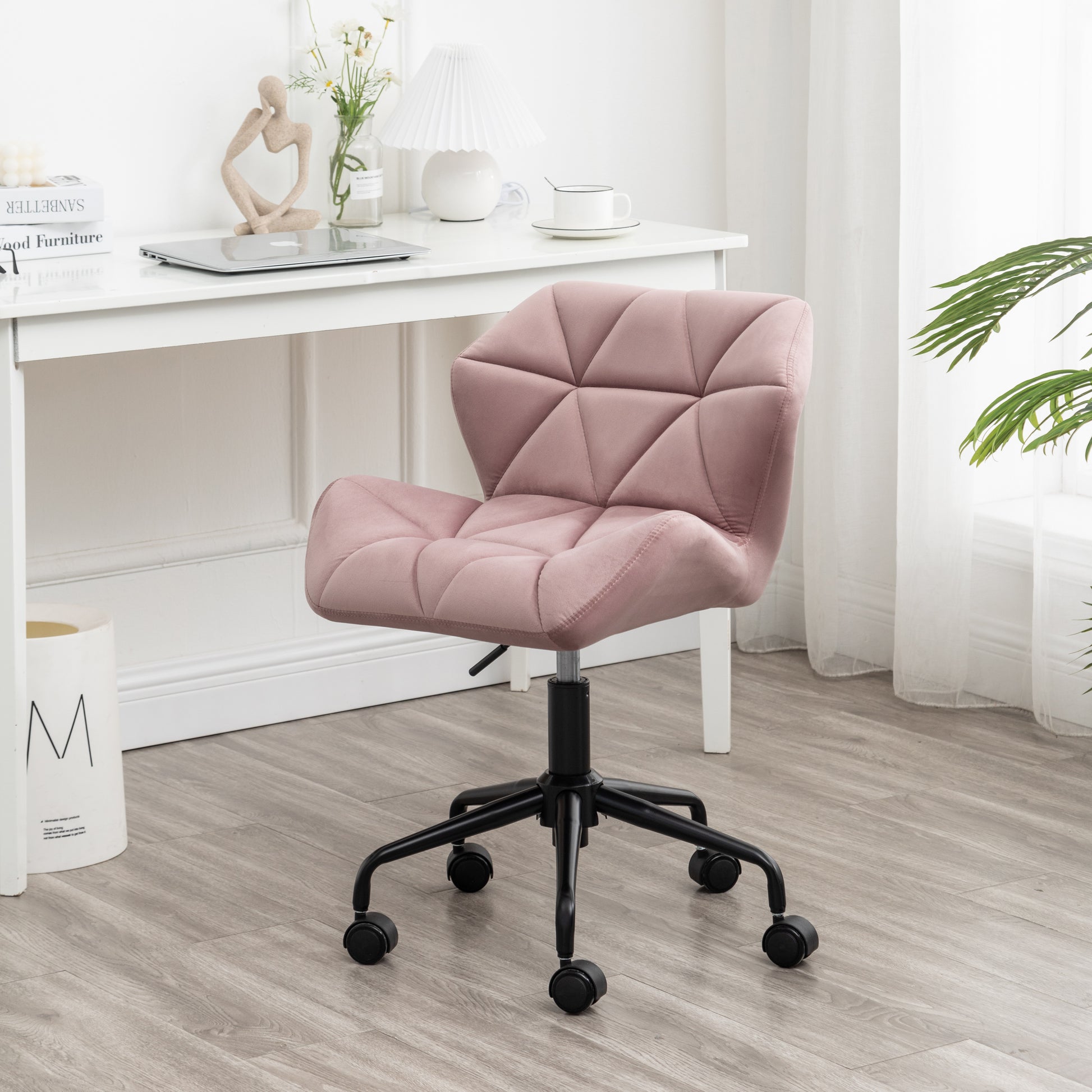 Dusty rose velvet office chair with diamond tufting and black casters