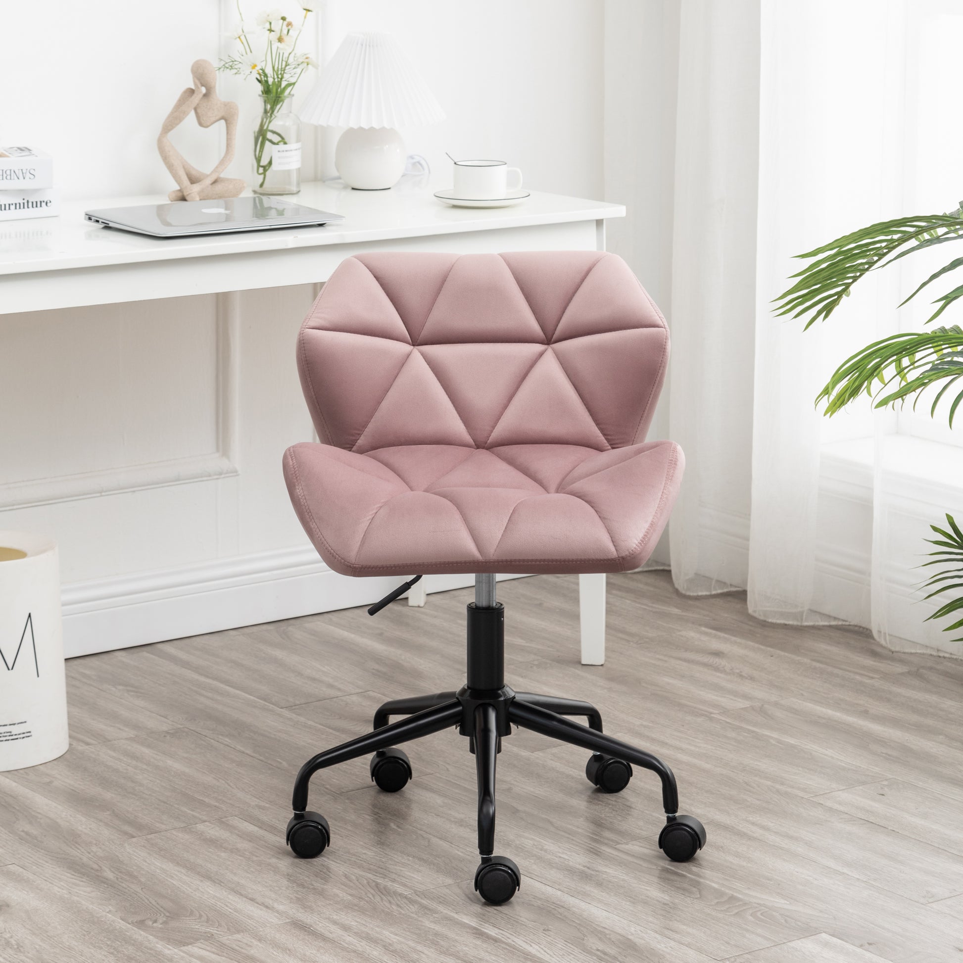 Pink velvet office chair with geometric tufting and adjustable height perfect for a modern home office