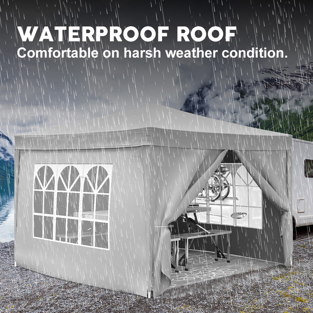 Gray waterproof canopy tent set up outdoors with arched windows and open front