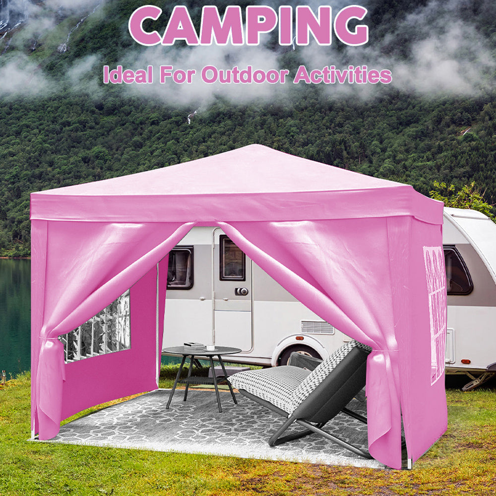 Pink popup canopy tent set up by a camper perfect for outdoor events